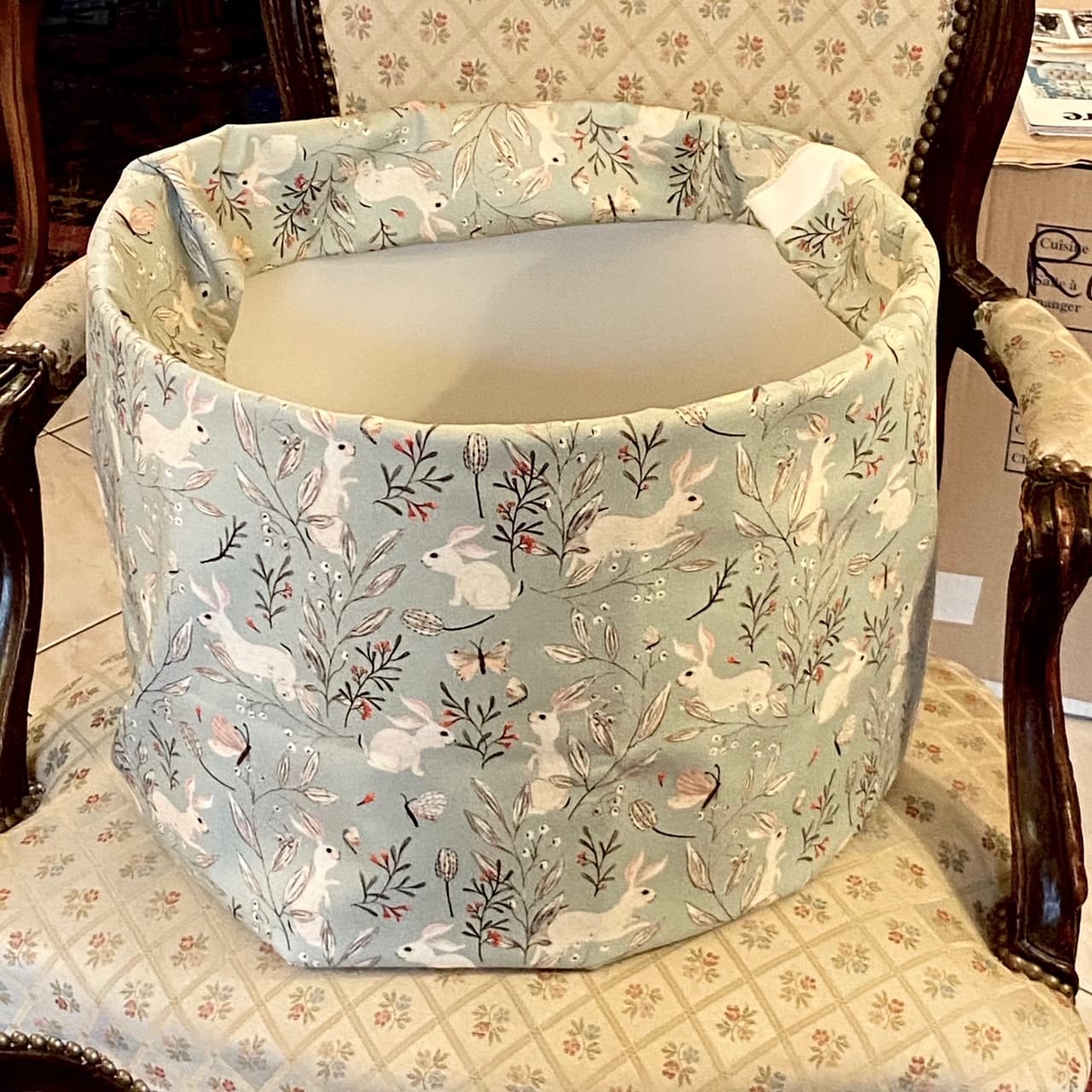 Fabric featuring small rabbits on a grey-blue background, view 2