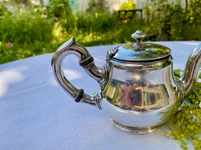 A lovely little silver-coloured metal teapot by Cailar Bayard, view 2