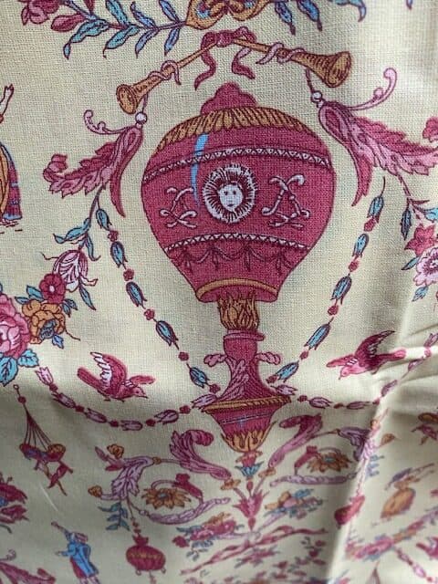 Toile de Jouy fabric in a pink pattern on a cream background, view 2